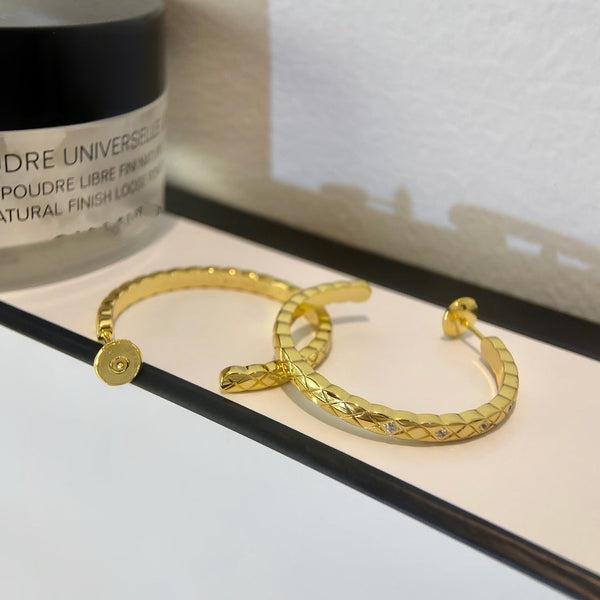 ORECCHINI A CERCHIO CON DIAMANTI CRUSH