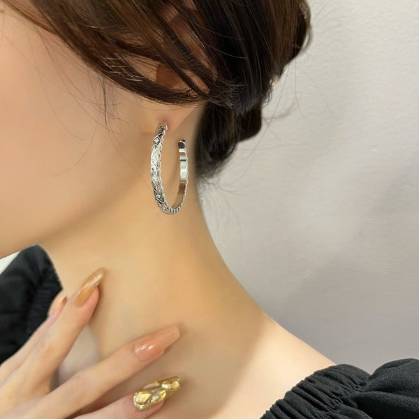 ORECCHINI A CERCHIO CON DIAMANTI CRUSH