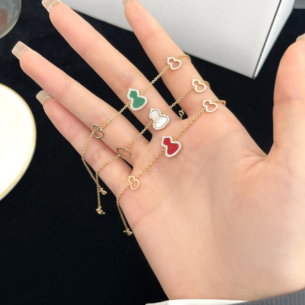 BRACCIALE WULU IN ORO ROSA CON 3 MOTIVI DI DIAMANTI