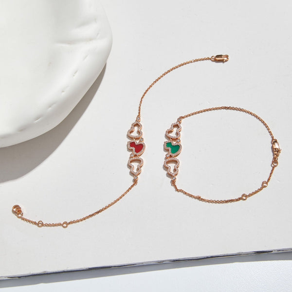 BRACCIALE WULU IN ORO ROSA CON 3 MOTIVI DI DIAMANTI