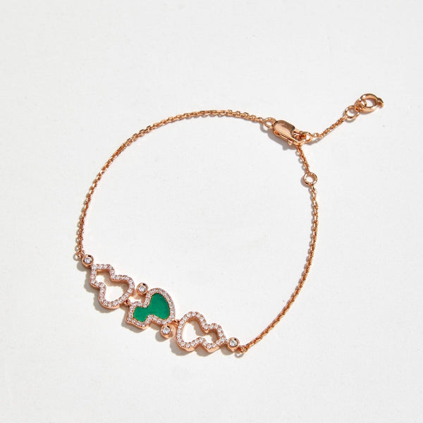 BRACCIALE WULU IN ORO ROSA CON 3 MOTIVI DI DIAMANTI