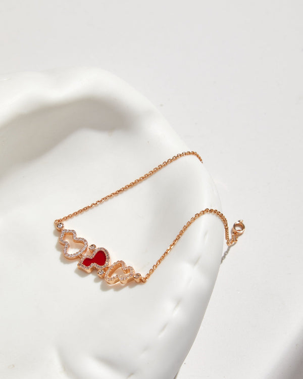 BRACCIALE WULU IN ORO ROSA CON 3 MOTIVI DI DIAMANTI