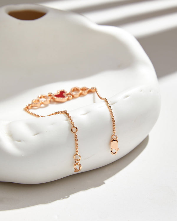 BRACCIALE WULU IN ORO ROSA CON 3 MOTIVI DI DIAMANTI