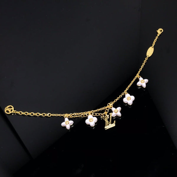 BRACCIALE IN ORO CON STELLA E SOLE CON MOTIVO LV LOGO 6