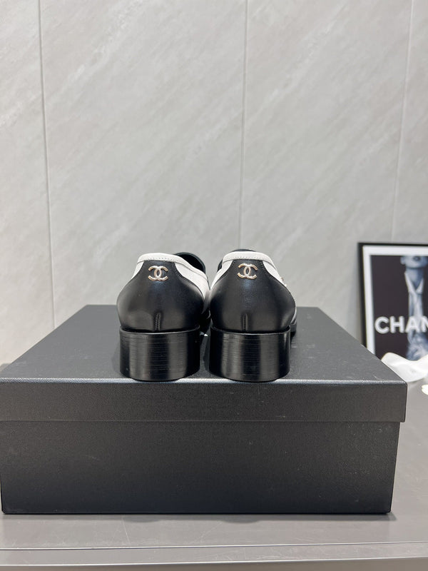 CC 25S Round Toe Chain Loafers in Black and White Cowhide 442533