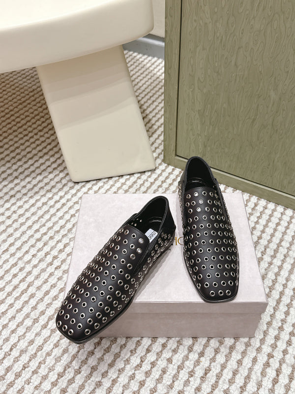 Mules plates Jimmy Choo Eliot Œillets métalliques Cuir de veau noir 568492