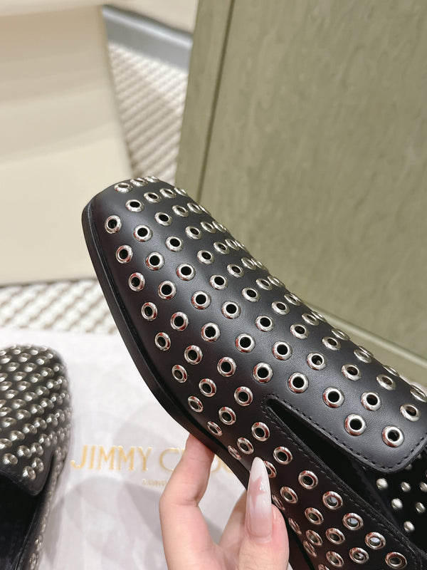 Mules plates Jimmy Choo Eliot Œillets métalliques Cuir de veau noir 568492