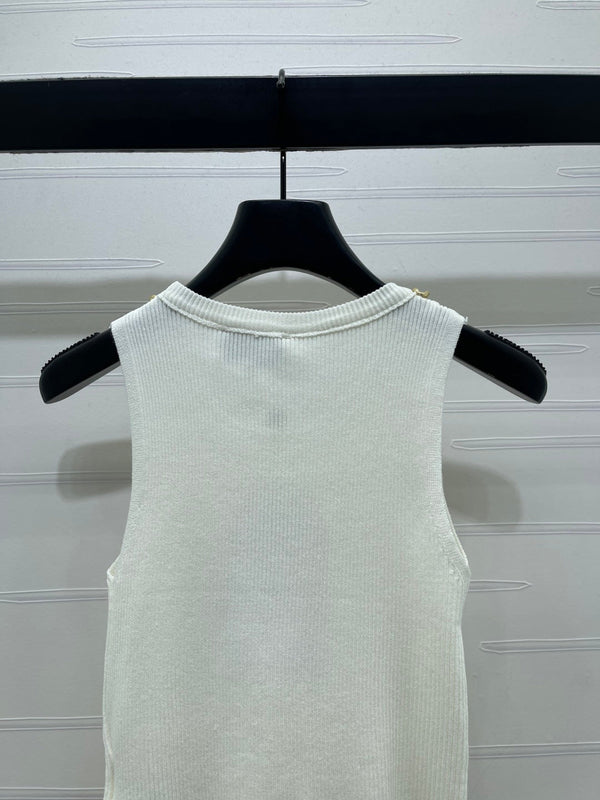 GILET EN MAILLE TRICOTÉE AVEC CHAÎNE CHANEL 26 EN LAINE NOIRE 335389