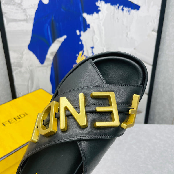 FENDI GRAPHY LOGO LETTERING SLIDES IN BLACK LAMBSKIN WITH GOLD HARDWARE