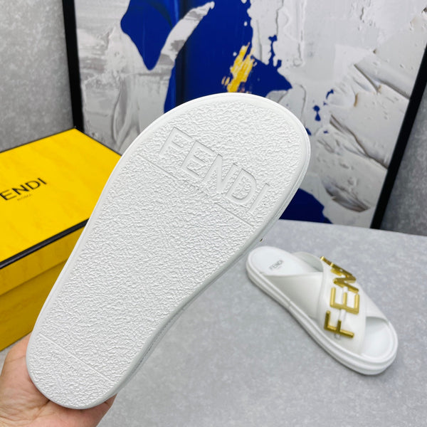 FENDI GRAPHY LOGO LETTERING SLIDES IN WHITE LAMBSKIN WITH GOLD HARDWARE