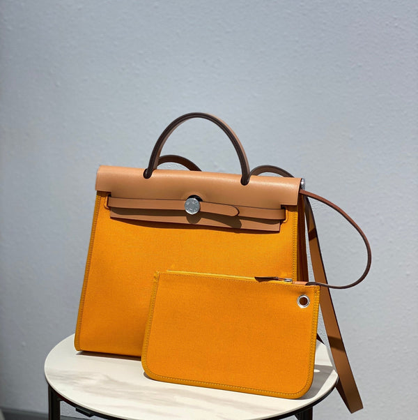 Herbag 31 Toile Tela Giallo Scuro Pelle di Vacchetta Dorata
