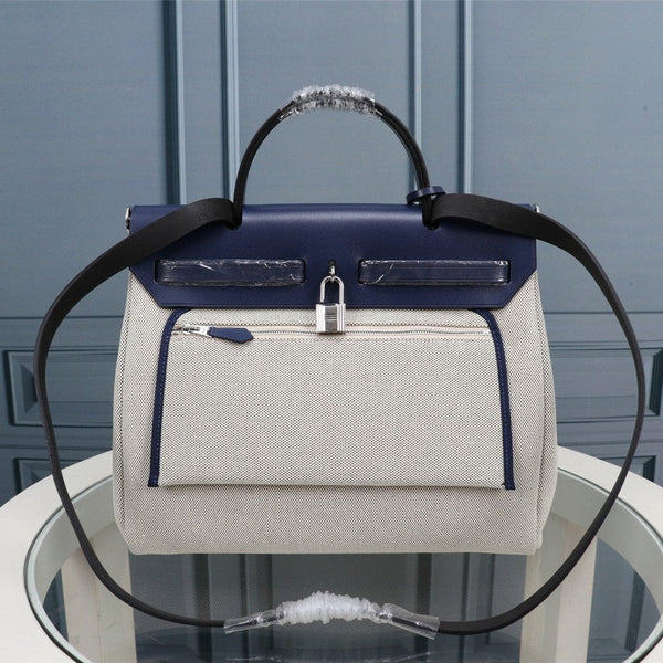 HM HERBAG ZIP 31 NAVY AND CREAM MONOGRAM CANVAS