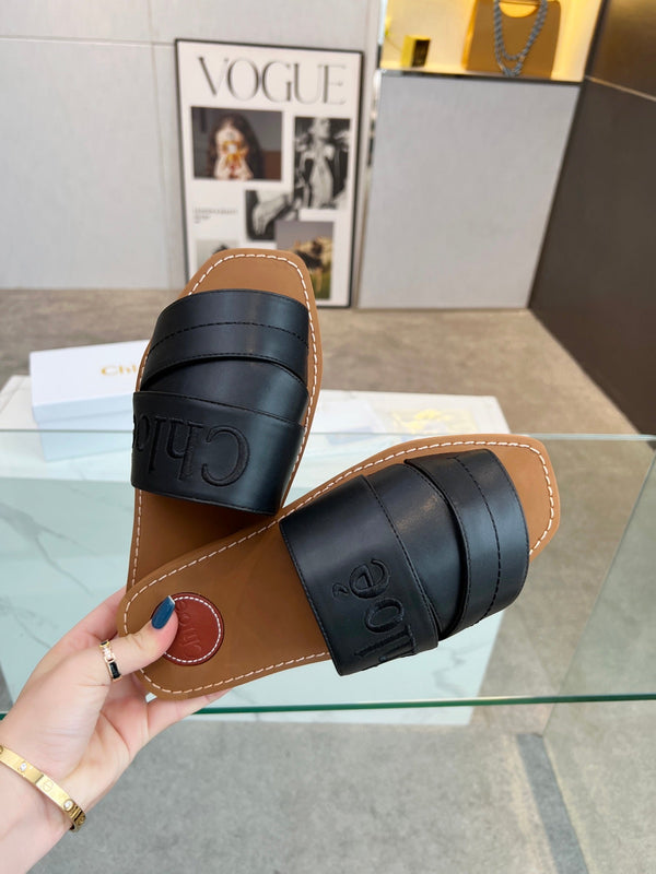 CHLOÉ WOODY MULE IN BLACK LAMBSKIN WITH EMBROIDERED LOGO