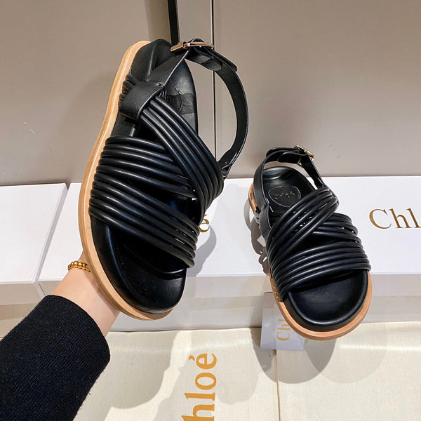 CHLOÉ CROSS STRAP SANDAL IN BLACK RUBBER WITH GOLD HARDWARE