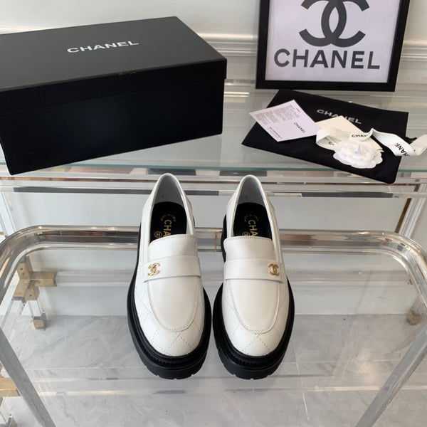 mocassini bianchi neri in pelle di vitello trapuntata