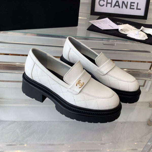 mocassini bianchi neri in pelle di vitello trapuntata