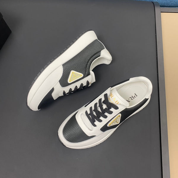 PRA SNEAKER IN WHITE CALFSKIN AND BLACK FABRIC WITH GOLDEN LOGO