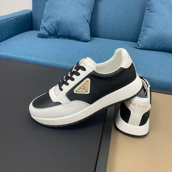 PRA SNEAKER IN WHITE CALFSKIN AND BLACK FABRIC WITH GOLDEN LOGO