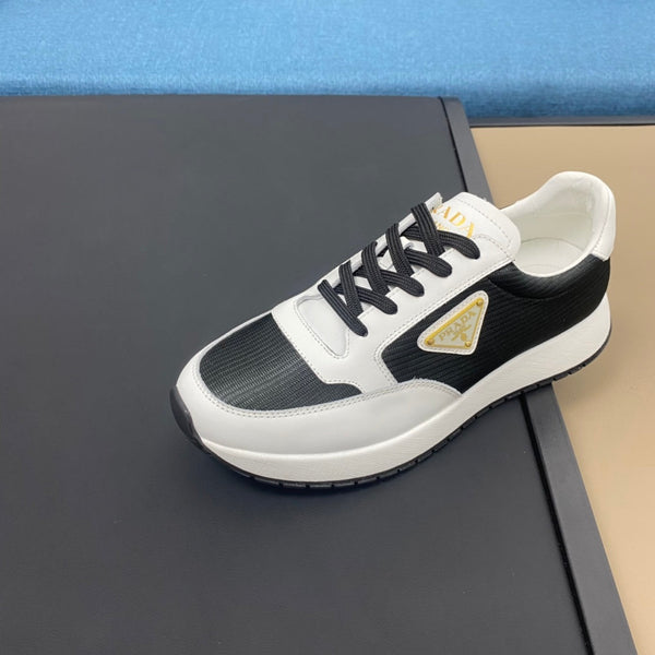 PRA SNEAKER IN WHITE CALFSKIN AND BLACK FABRIC WITH GOLDEN LOGO