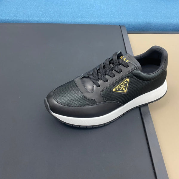 PRA SNEAKER IN BLACK CALFSKIN AND FABRIC WITH GOLDEN LOGO