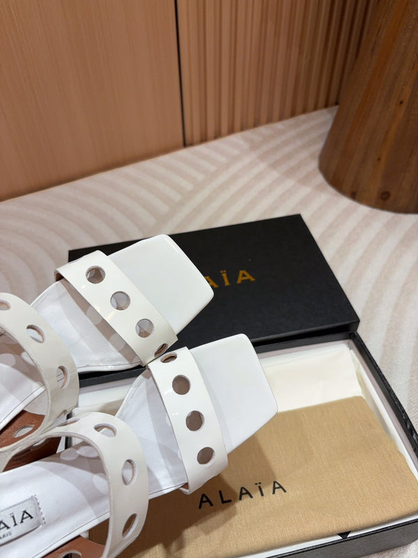 ALAIA TWO-STRAPS HIGH HEEL SANDALS IN WHITE PATENT LAMBSKIN