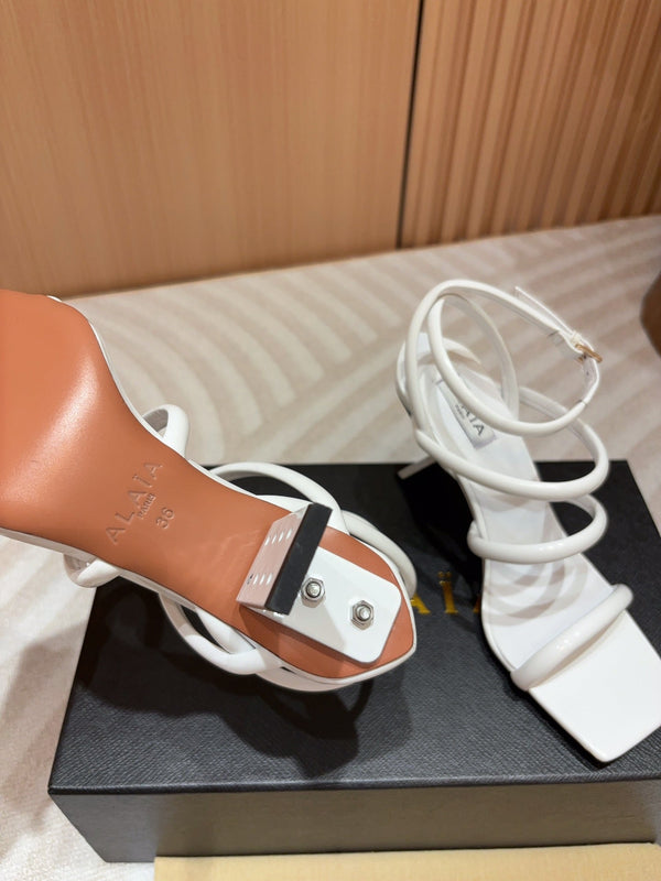 ALAIA THREE-STRAPS HIGH HEEL SANDALS IN WHITE PATENT LAMBSKIN