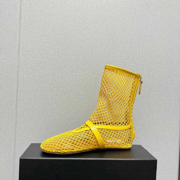 ALAIA SHORT BOOTS IN LEMON YELLOW MESH FISHNET