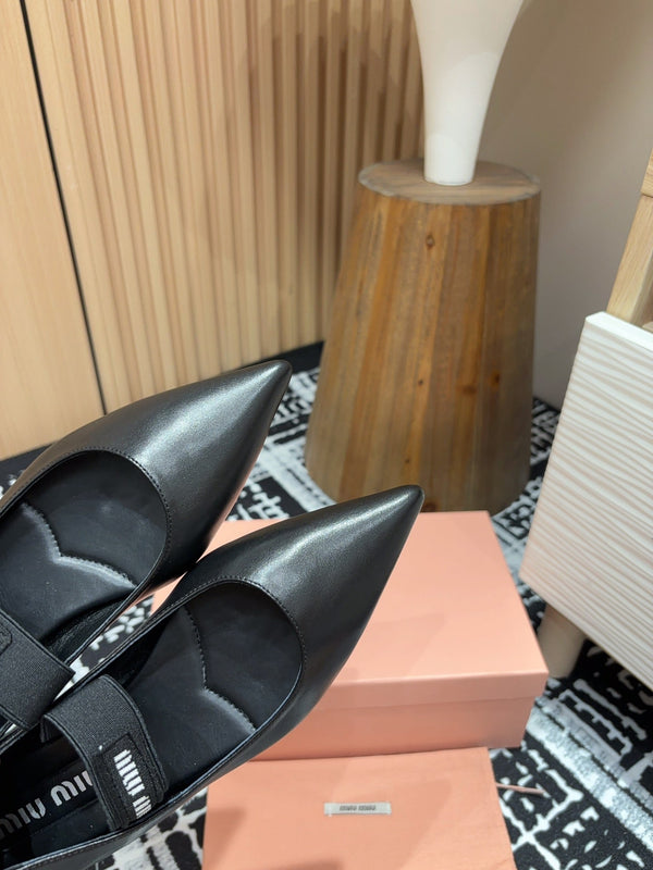 Ballerines Miu en peau de mouton noire