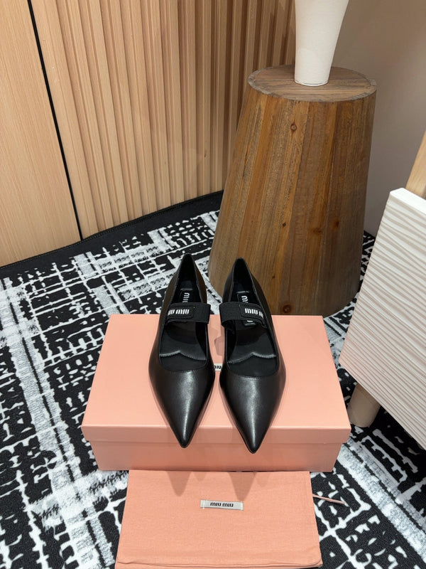 Ballerines Miu en peau de mouton noire