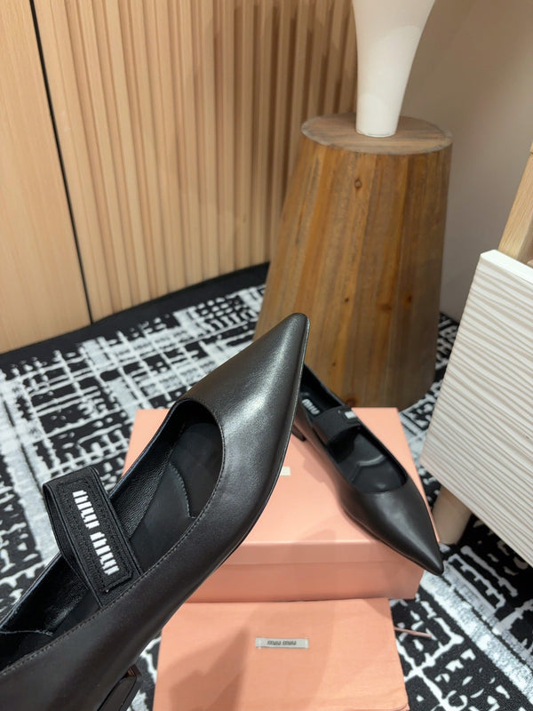 Ballerines Miu en peau de mouton noire
