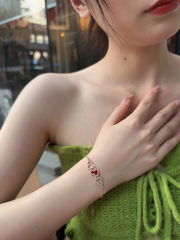 BRACCIALE WULU IN ORO ROSA CON 3 MOTIVI DI DIAMANTI