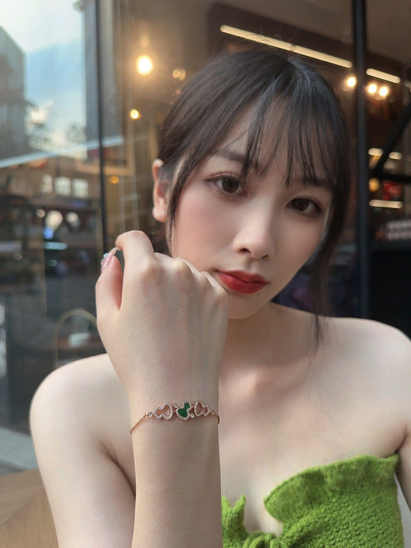 BRACCIALE WULU IN ORO ROSA CON 3 MOTIVI DI DIAMANTI