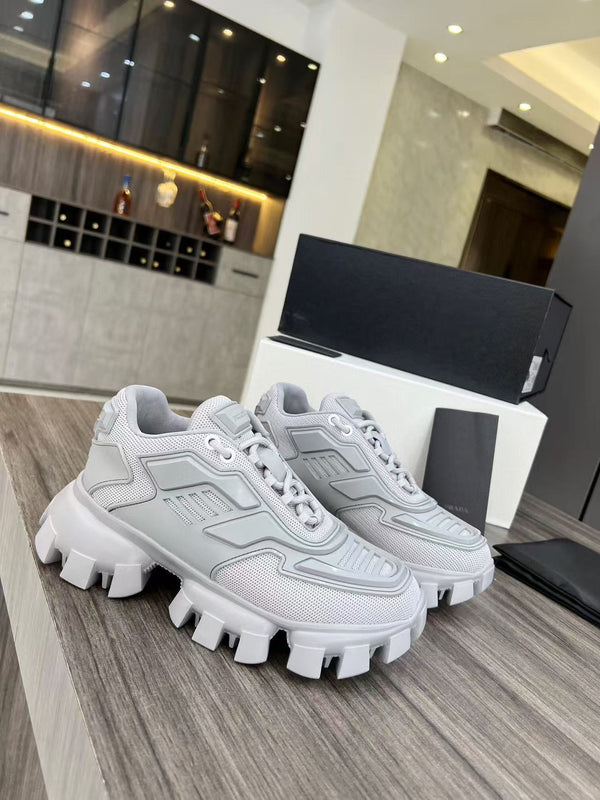 Sneakers Prada Cloudbust Thunder in tessuto lavorato a maglia bianco misto grigio perla