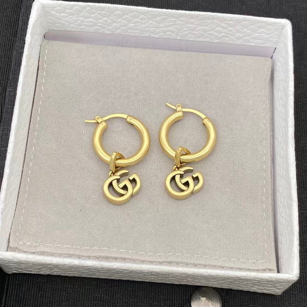 Boucles d'oreilles pendantes GG Running en or