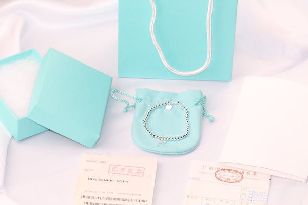 STERLING SILVER BOW BEAD BRACELET