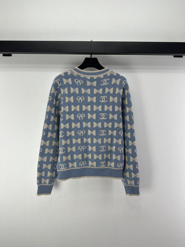 Cardigan Chanel 2025 avec nœud et logo double C en cachemire 329237
