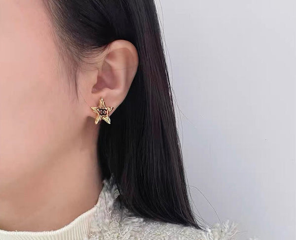 orecchini a bottone in smalto nero cc star