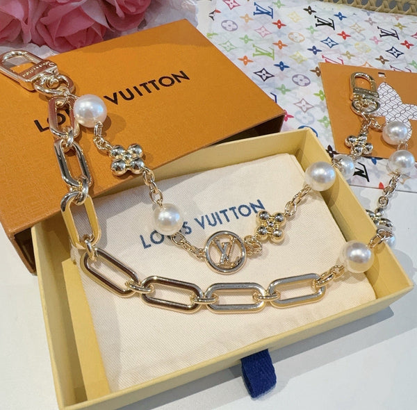 LV Figaro Charm Lustrous Brass