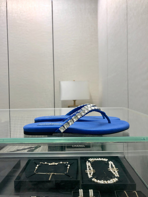 THONG SLIDE IN COBALT BLUE SUEDE WITH WHITE CRYSTALS