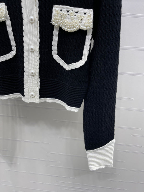 Chanel 25 Cardigan Laine noire mélangée blanche 321300