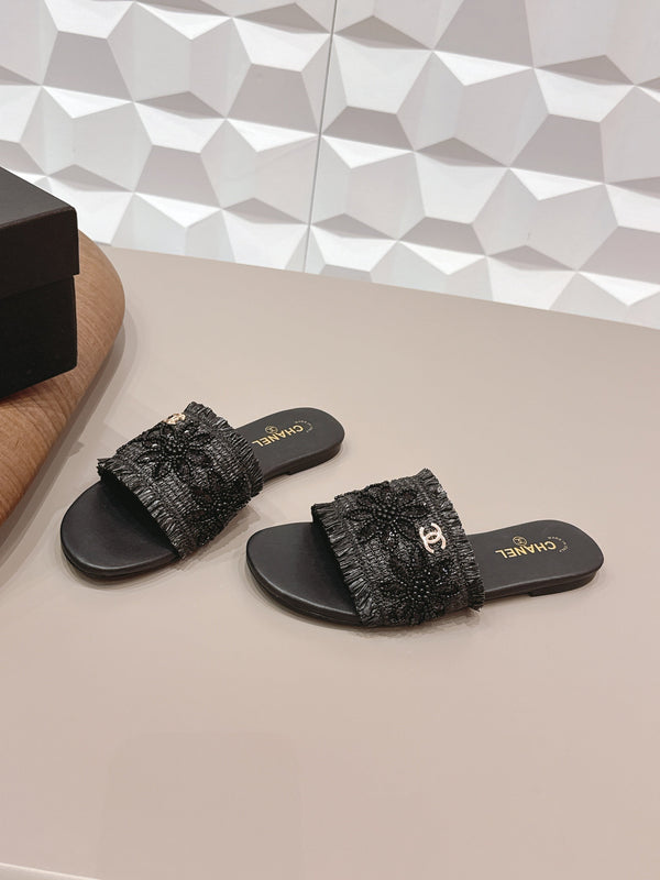 Sandales plates CC 26s en paille noire et cuir 613263