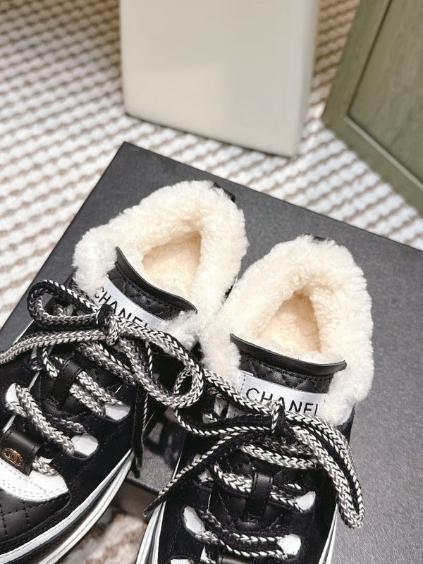 Chanel 26s Thick-Sole Sneakers In Black And White Calfskin With Fur Lining