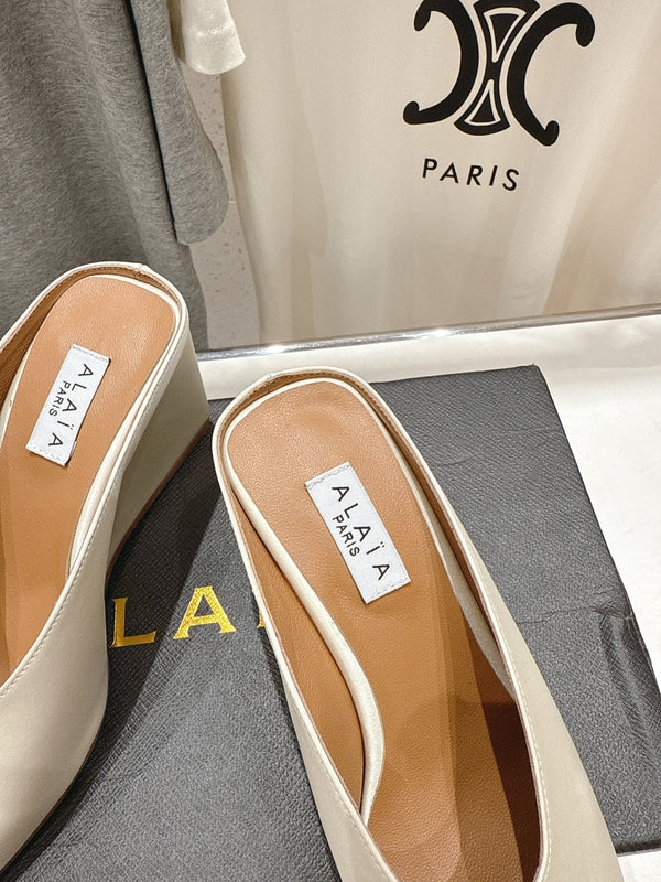 Alaia 25 Cube Wedge Mules Ivory Silk Sheepskin 300080