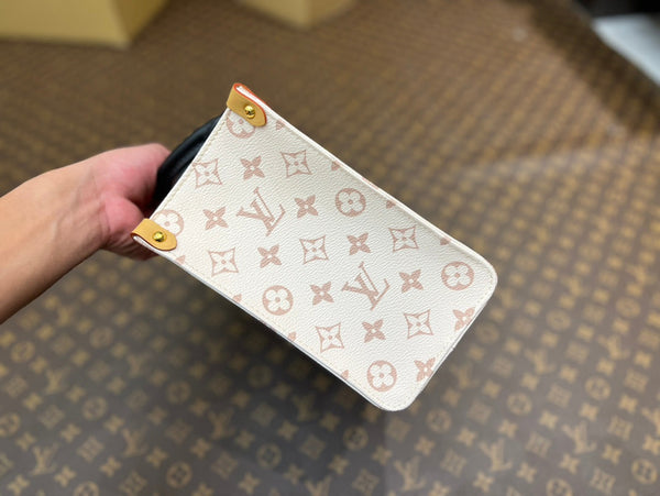 onthego pm 25 cream monogram empreinte embossed calfskin bagcharm