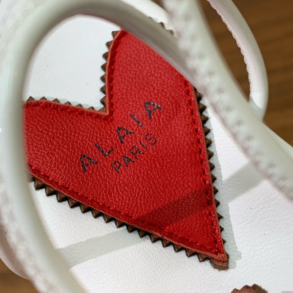 ALAIA BANQUET WEDGE SANDALS IN WHITE LAMBSKIN WITH RED HEART