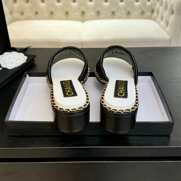 PANTOFOLA ALTE FLATFORM IN PELLE DI MONTONE GOFFRATA NERA