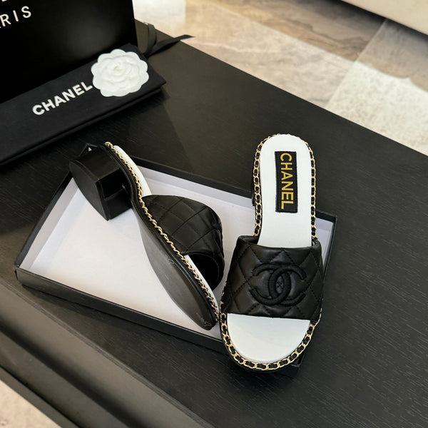 PANTOFOLA ALTE FLATFORM IN PELLE DI MONTONE GOFFRATA NERA