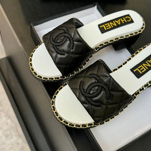 PANTOFOLA ALTE FLATFORM IN PELLE DI MONTONE GOFFRATA NERA