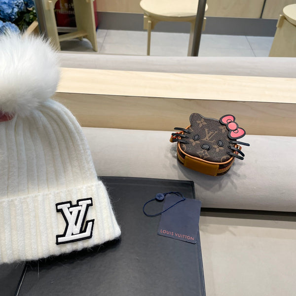 BERRETTO IN MAGLIA DI LANA BIANCA 413368