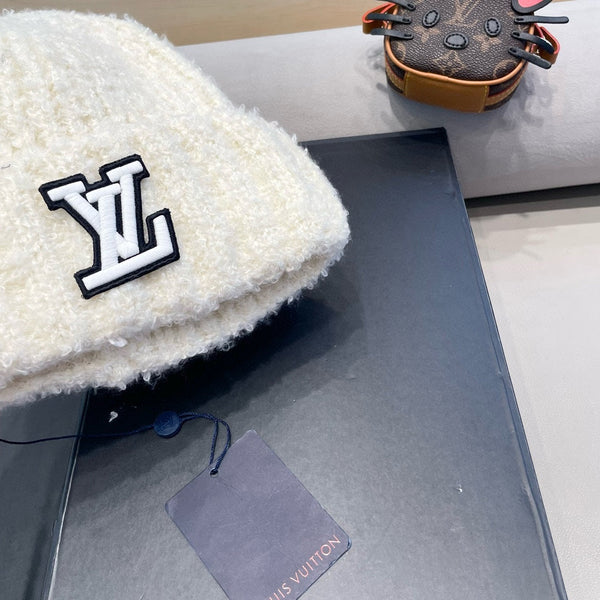 BERRETTO IN MAGLIA DI LANA BIANCA 421265